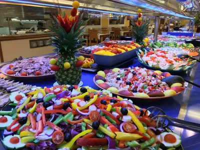a buffet filled with lots of different types of food at Hotel Mar Blau in Calella