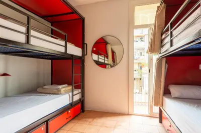 a room with two bunk beds and a mirror at Mambo Tango in Barcelona