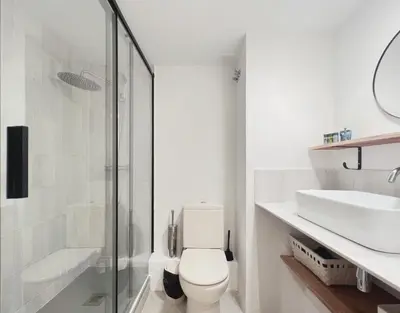 a white bathroom with a toilet and a sink at Stay U-nique Apartments Urquinaona II in Barcelona