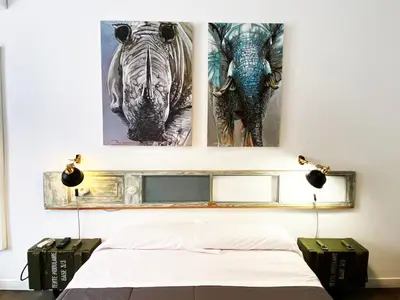 a bedroom with two pictures of zebras on the wall at Hostal Portugal in Barcelona