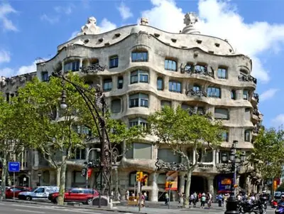 a large building on the corner of a street at Plaza Universitat in Barcelona