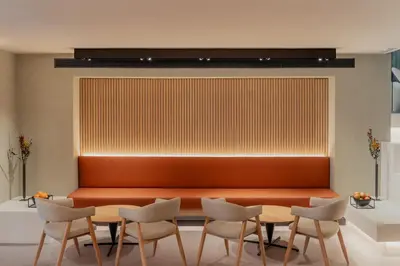 a waiting room with a bench and chairs at Hotel Arconte, Adults Only in Barcelona