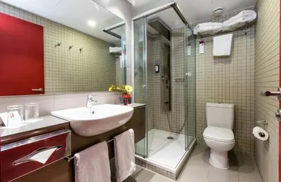 a bathroom with a sink and a toilet and a shower at Leonardo Boutique Hotel Barcelona Sagrada Familia in Barcelona