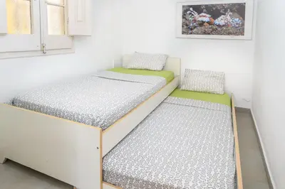 a small room with two beds in it at Private Roof Top Sant Antoni in Barcelona