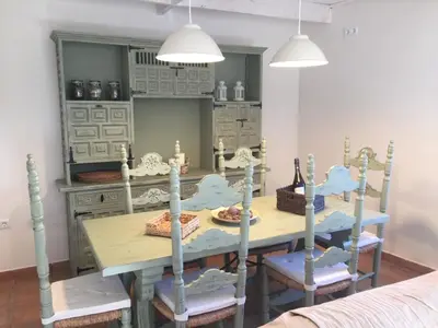 a dining room with a table and chairs at Montserrat La Calsina in Monistrol