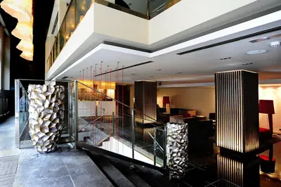 a lobby of a hotel with a staircase at Grums Hotel & Spa in Barcelona