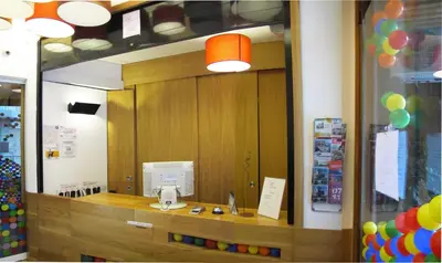 a mirror reflection of a counter in a store at Hostal Athenas in Sant Adria de Besos