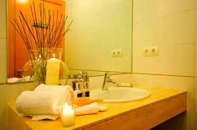 a bathroom with a sink and a candle on a counter at Tendency Apartments 3 in Barcelona