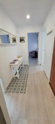 an empty hallway with a desk in a room at APARTAMENTS B O D CoLLBLANC in Hospitalet de Llobregat