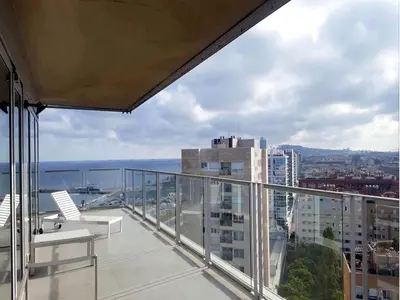 a balcony with a view of a city at You Stylish Beach Apartments in Barcelona