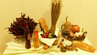 a table with a bunch of vegetables and wine bottles at Balcones y Vistas en el Centro de la Ciudad in Barcelona