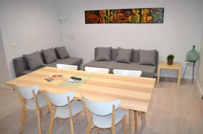 a room with hangers and a brown towel on a table at Poble Sec Apartments in Barcelona