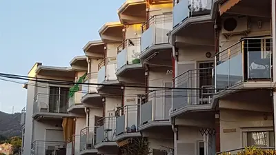an apartment building with balconies on the side of it at Apartamento Playa Mar in Castelldefels