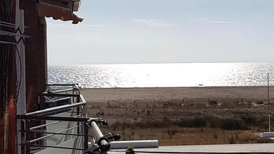 a view of the ocean from a balcony of a building at Apartamento Playa Mar in Castelldefels
