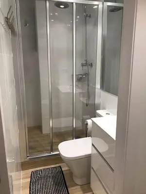 a bathroom with a shower and a toilet and a sink at Apartamento Playa Mar in Castelldefels