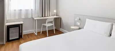 a coffee shop with two coffee machines on a shelf at B&B HOTEL Barcelona Mataro in Mataró