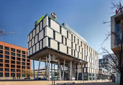 a building with a sign on top of it at B&B HOTEL Barcelona Mataro in Mataró