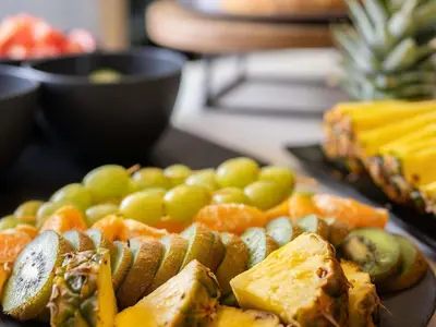 a table with a variety of fruits and vegetables at Ibis Montmelo Granollers in Granollers