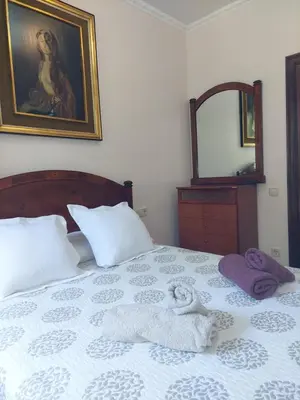 a bedroom with a bed with towels on it at Apartamento Gran Via de les Corts Catalanes in Barcelona
