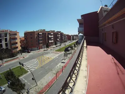 a view of a city street from a balcony at Hostal Restaurante Cornella in Cornellà de Llobregat