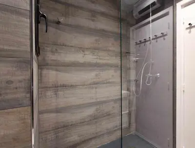 a bathroom with a shower with a glass door at Sitges Bellavista · Vistas Espectaculares del Mar in Sitges