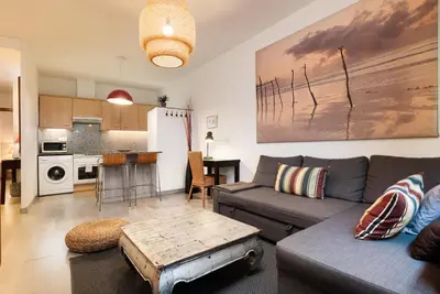 a living room with a couch and a table at Portal Del Angel Barcelona Apartment in Barcelona