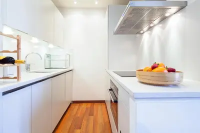 a bowl of fruit on a counter in a kitchen at Inside Barcelona Apartments Mercat in Barcelona