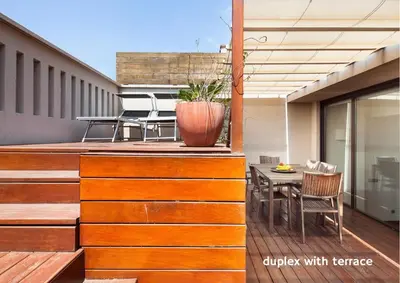 a balcony with a table and a vase on it at Inside Barcelona Apartments Mercat in Barcelona