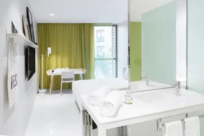a bathroom with a sink and a mirror at Hotel Rec Barcelona - Adults Only in Barcelona