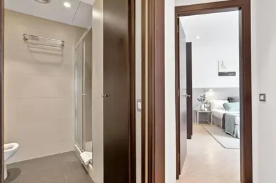 a bathroom with a shower and a toilet in a room at Fisa Rentals Gran Via Apartments in Barcelona
