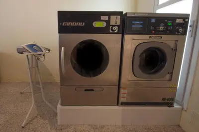 a washing machine and a dryer sitting next to each other at Studio Hostel in Barcelona