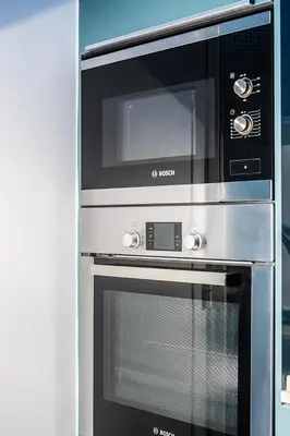 a microwave oven sitting next to a stove at Apartamento Sants in Barcelona