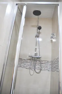 a shower with a shower head in a bathroom at Apartamento Sants in Barcelona