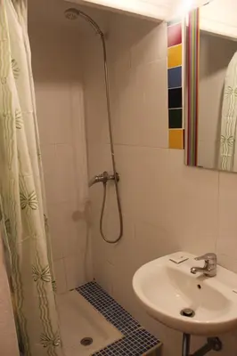 a bathroom with a shower and a sink at Pensión Arosa in Barcelona
