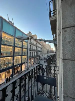 a balcony of a building with a view of a city at Pensión Arosa in Barcelona