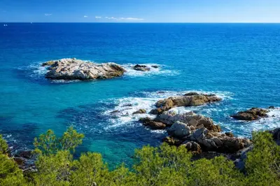 a group of rocks in the water near the ocean at Catalunya Casas Modern Magnificence , only a few km to the beach! in Sant Cebrià de Vallalta