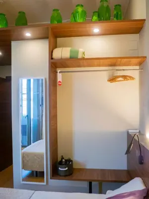a bunk bed in a room with green vases at Pension Ciudadela in Barcelona