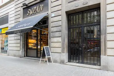 a store front with a sign in front of it at Charm Apartment Sagrada Familia in Barcelona