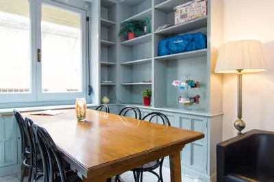 a dining room with a wooden table and chairs at Charm Apartment Sagrada Familia in Barcelona