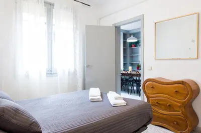 a bedroom with a bed with two towels on it at Charm Apartment Sagrada Familia in Barcelona