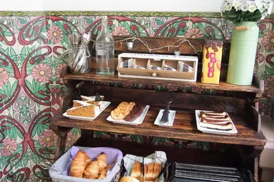 a table with different types of bread and pastries at Hotel El Xalet in Sitges