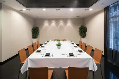 a conference room with a white table and chairs at Catalonia Rigoletto in Barcelona