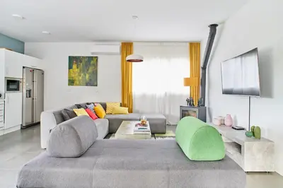 a living room with a couch and a table at Jewel Home in Sant Pere de Ribes