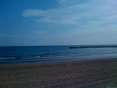 an empty beach with the ocean in the background at Mar De Cunit in Cunit