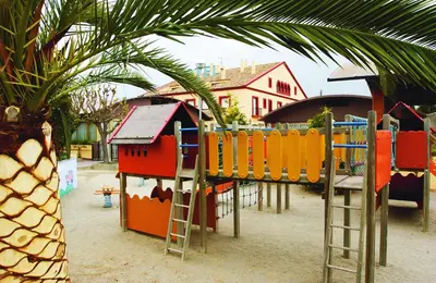 a playground with a slide and a play structure at Hotel Restaurant Sol i Vi in Lavern