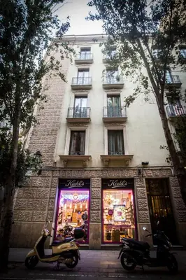 a scooter parked in front of a store at BCNGOTIC 42 in Barcelona