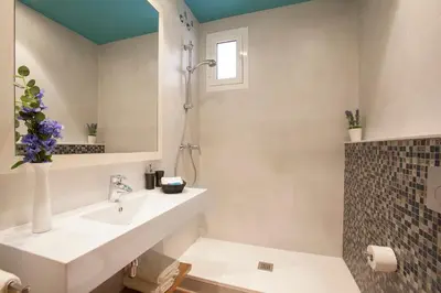 a bathroom with a sink and a shower at BCNGOTIC 42 in Barcelona