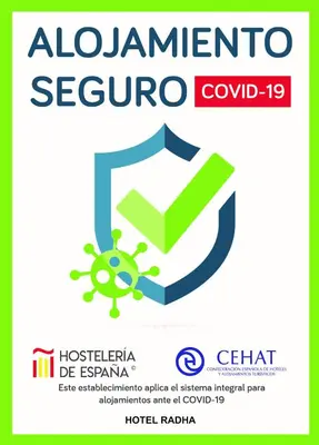 a logo for a coronavirus outbreak with a shield and a green arrow at Hotel Radha in Hospitalet de Llobregat
