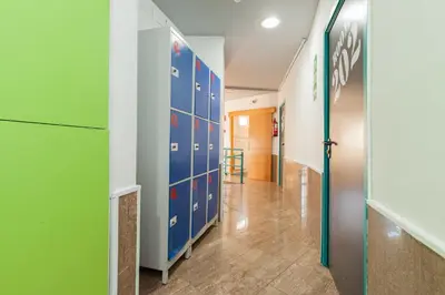 a hallway with blue and green dividers in a room at Mellow Barcelona in Barcelona