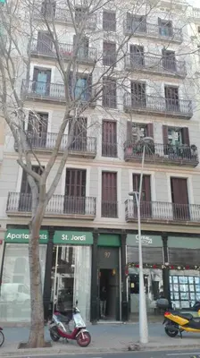 a scooter parked in front of a building at Apartaments Sant Jordi Girona 97 in Barcelona